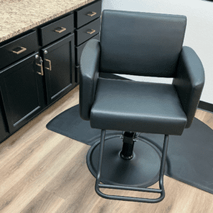 Black salon chair in modern workspace